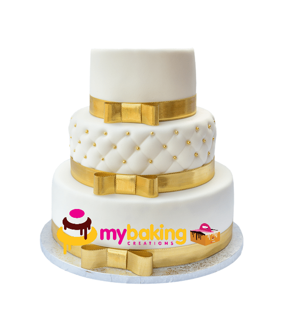 Elegant 3-tier white wedding cake with gold accents
